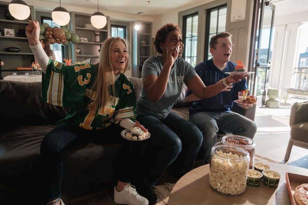 group of fans watching tv