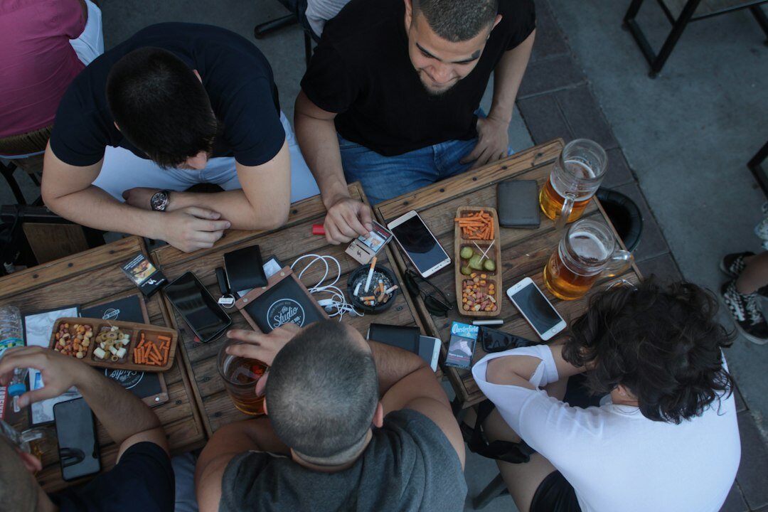 group of friends using phones