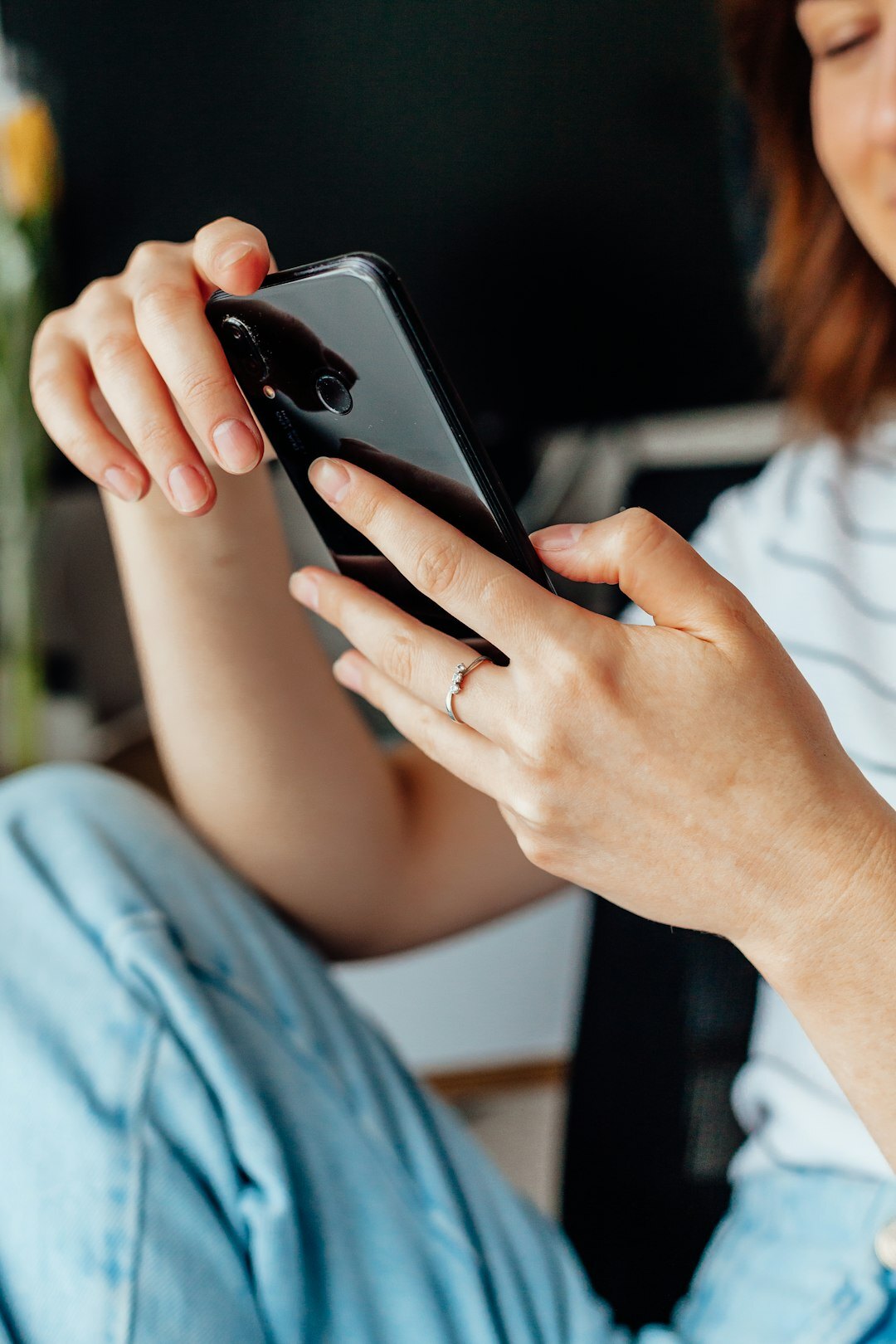 teenager scrolling phone